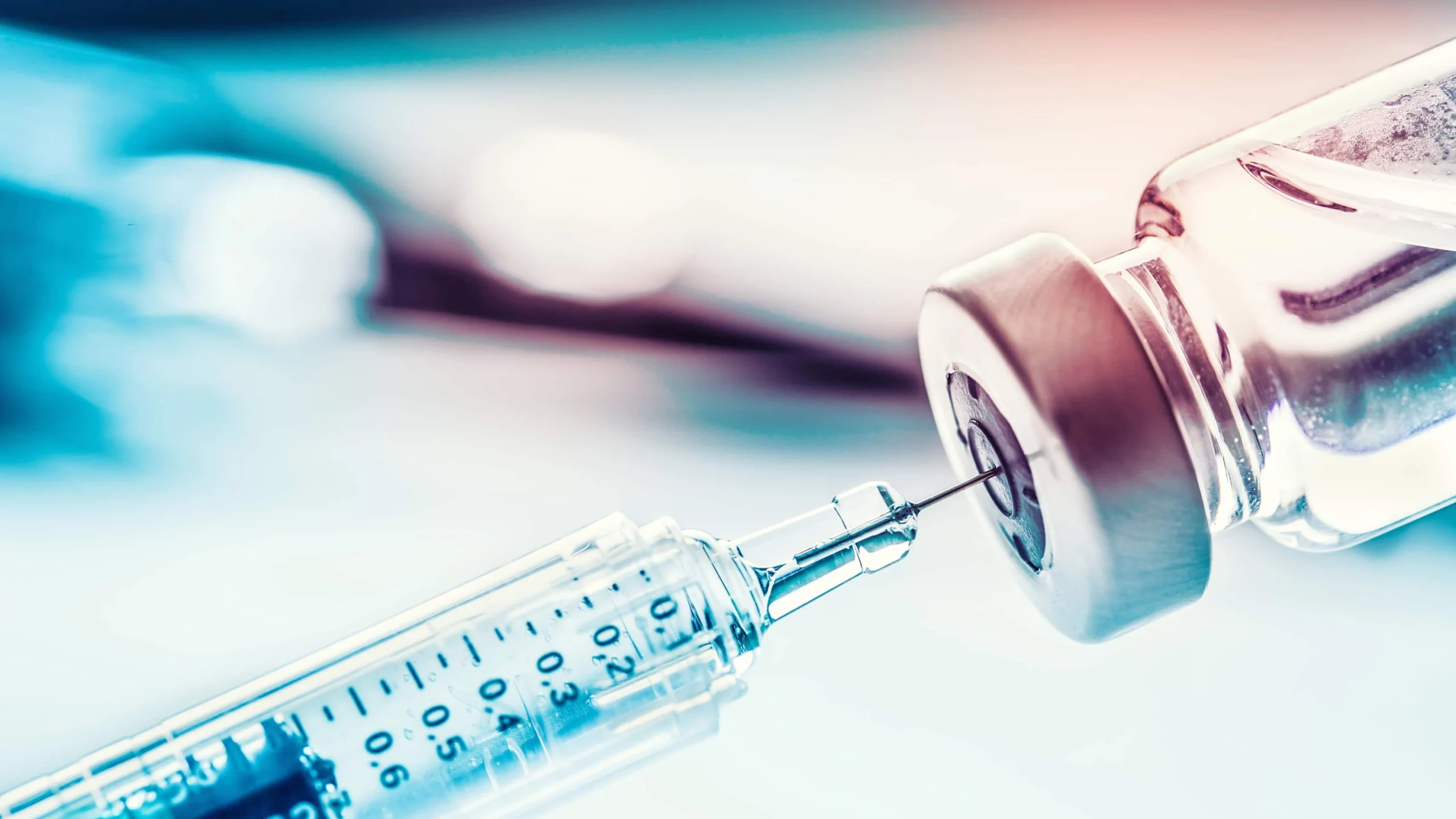 Close up syringe and vaccine vial